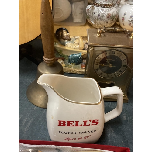 888 - A MIXED LOT TO INCLUDE FLATWARE, A BELL'S WHISKY WATER JUG, BRASS BELL, FIGURE AND MANTLE CLOCK