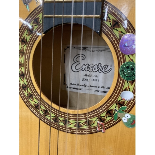 889 - AN ENCORE CHILD'S ACOUSTIC GUITAR WITH STAND AND CASE