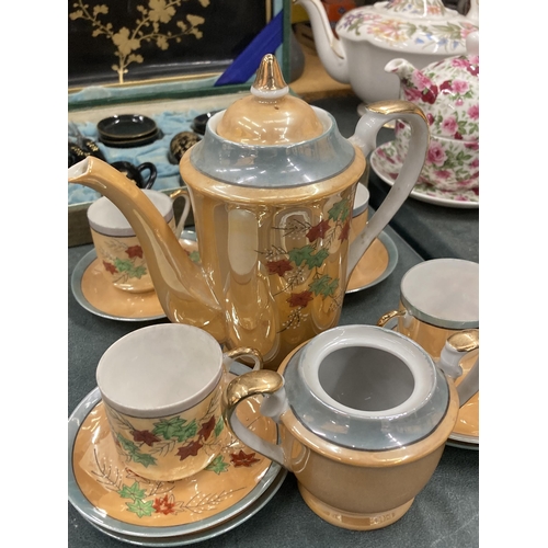 897 - AN ORANGE LUSTRE COFFEE SET TO INCLUDE A COFFEE POT, SUGAR BASIN CUPS AND SAUCERS PLUS A SET OF ORIE... 