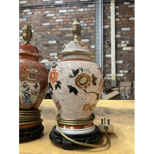 911 - TWO ORIENTAL STYLE TABLE LAMPS WITH WOODEN BASES HEIGHT APPROX 30CM