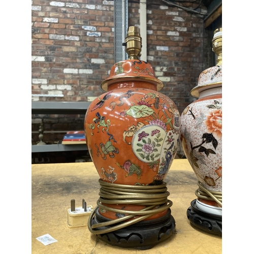 911 - TWO ORIENTAL STYLE TABLE LAMPS WITH WOODEN BASES HEIGHT APPROX 30CM