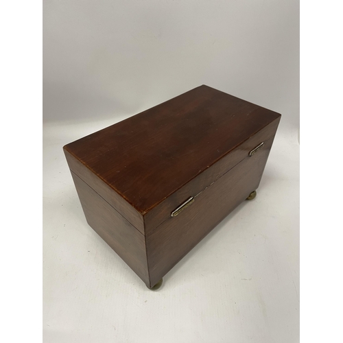 51 - A VICTORIAN MAHOGANY TEA CADDY WITH THREE INNER COMPARTMENTS, ON BUN FEET