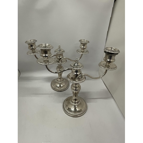 57 - A PAIR OF GOOD QUALITY SILVER PLATED TWIN BRANCH CANDLE HOLDERS