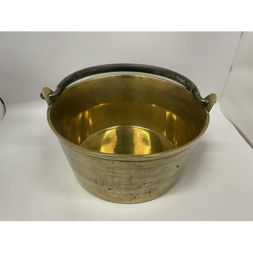 67 - A VINTAGE BRASS JAN PAN WITH CAST HANDLE