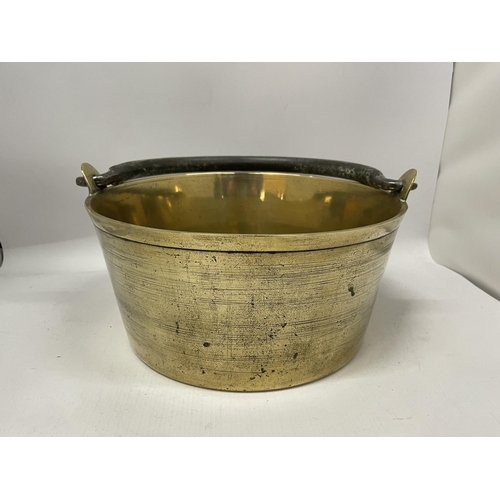 67 - A VINTAGE BRASS JAN PAN WITH CAST HANDLE