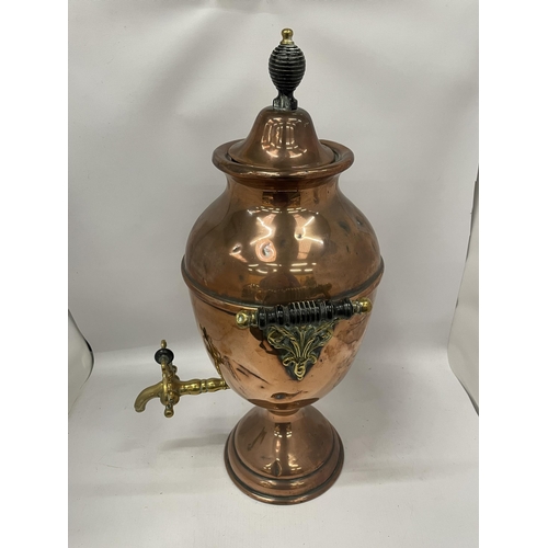 68 - AN EARLY 20TH CENTURY TWIN HANDLED COPPER SAMOVAR URN WITH BRASS TAP