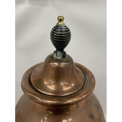 68 - AN EARLY 20TH CENTURY TWIN HANDLED COPPER SAMOVAR URN WITH BRASS TAP