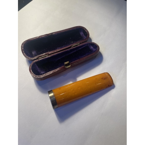 100 - AN AMBER CIGAR HOLDER WITH A HALLMARKED BIRMINGHAM SILVER COLLAR IN ORIGINAL PRESENTATION BOX