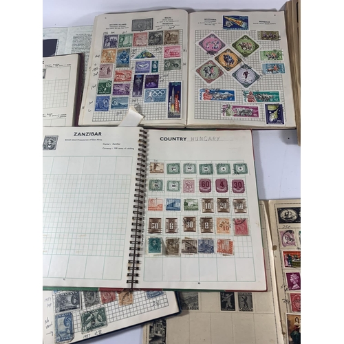 447A - EIGHT ALBUMS CONTAINING STAMPS FROM AROUND THE WORLD