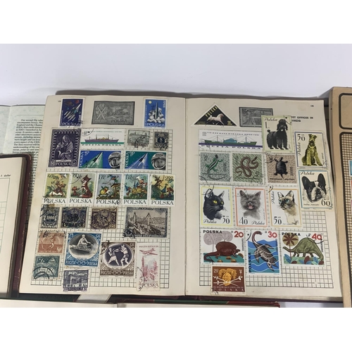 447A - EIGHT ALBUMS CONTAINING STAMPS FROM AROUND THE WORLD