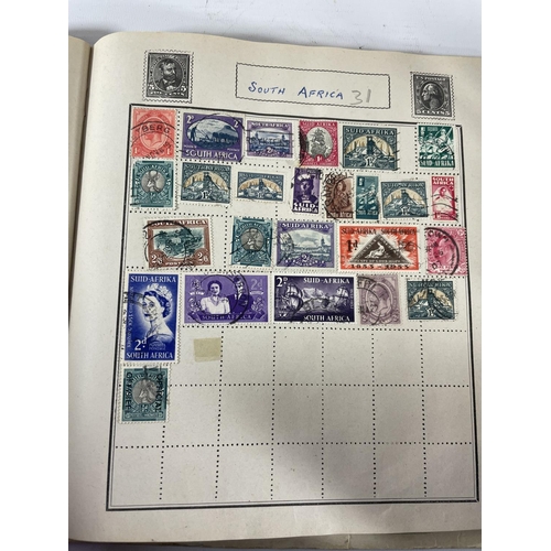 497 - ONE HUNDRED AND FIFTY TWO 10P NATIONAL TRANSPORT TOKENS, A STAMP ALBUM WITH STAMPS FROM 55 COUNTRIES... 