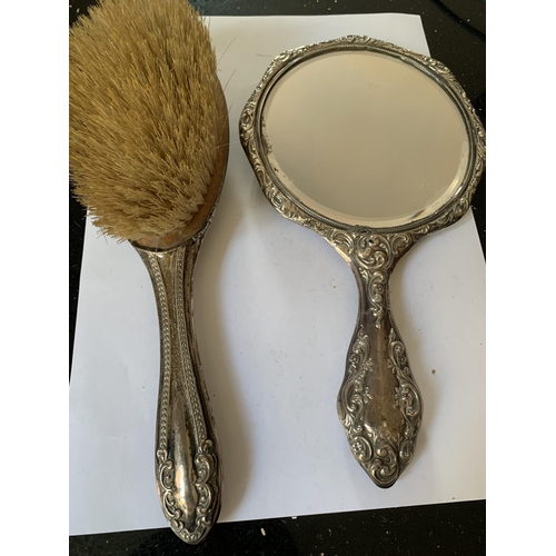 687 - TWO HALLMARKED BIRMINGHAM SILVER ITEMS TO INCLUDE A BRUSH AND A MIRROR