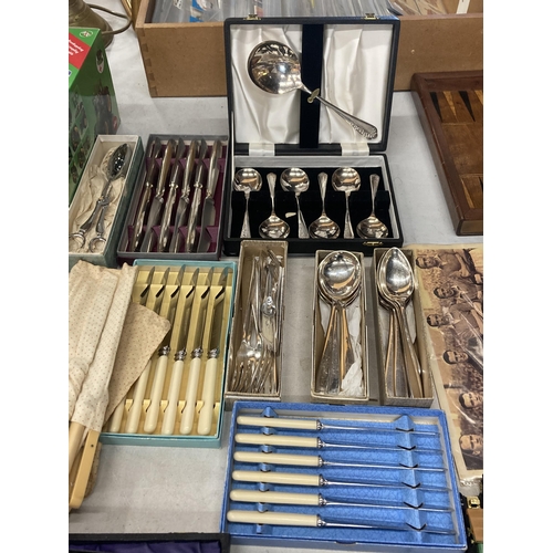 1010 - A LARGE QUANTITY OF BOXED VINTAGE FLATWARE TO INCLUDE FISH KNIVES AND FORKS, SERVING SPOONS, ETC