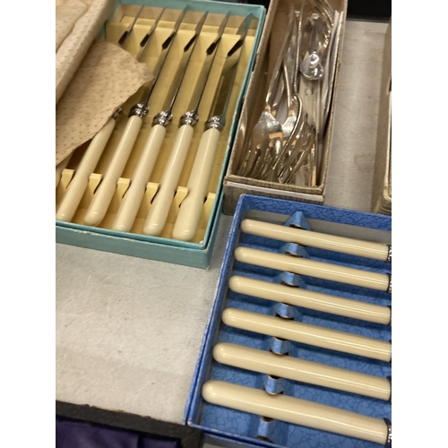 1010 - A LARGE QUANTITY OF BOXED VINTAGE FLATWARE TO INCLUDE FISH KNIVES AND FORKS, SERVING SPOONS, ETC