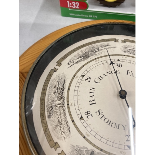 1018 - A VINTAGE PINE FRAMED ROUND ANEROID BAROMETER DIAMETER APPROX 30CM