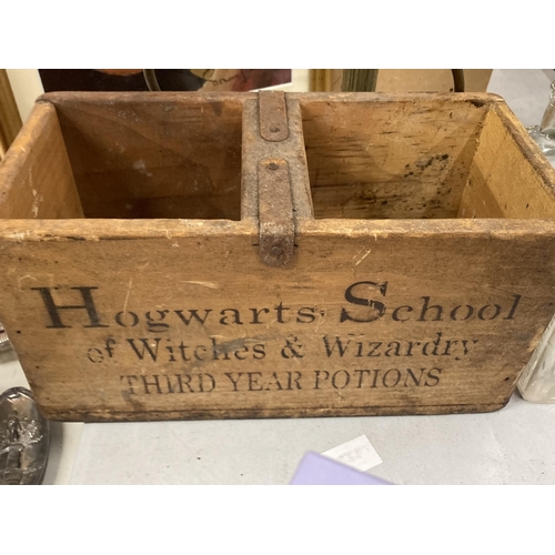 1021 - A HOGWARTS SCHOOL OF WITCHES AND WIZARDRY POTIONS AND SPELLS WOODEN BOX WITH THREE GLASS BOTTLES