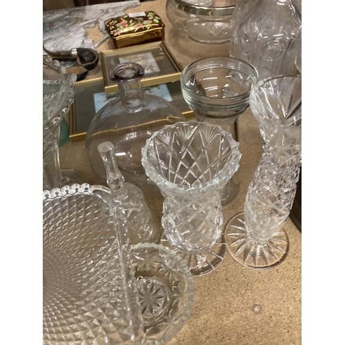 1030 - A LARGE QUANTITY OF GLASSWARE TO INCLUDE A CAKE STAND, TRINKET POT, VASES, CANDLESTICK ETC.,