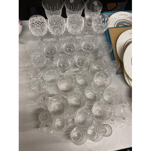 1036 - A LARGE QUANTITY OF CRYSTAL DRINKING GLASSES AND DESSERT BOWLS TO INCLUDE RED AND WHITE WINE, WHISKE... 