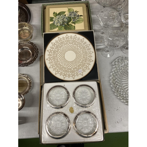 1039 - A QUANTITY OF BOXED PLACEMATS TOGETHER WITH SILVER PLATE AND GLASS COASTERS