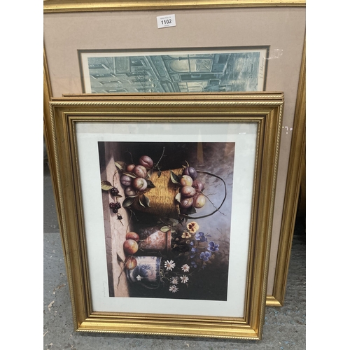 1102 - THREE GILT FRAMED PRINTS, TWO STILL LIFE FLOWERS AND FRUITS, THE OTHER A VICTORIAN STREET SCENE