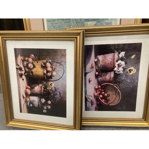 1102 - THREE GILT FRAMED PRINTS, TWO STILL LIFE FLOWERS AND FRUITS, THE OTHER A VICTORIAN STREET SCENE