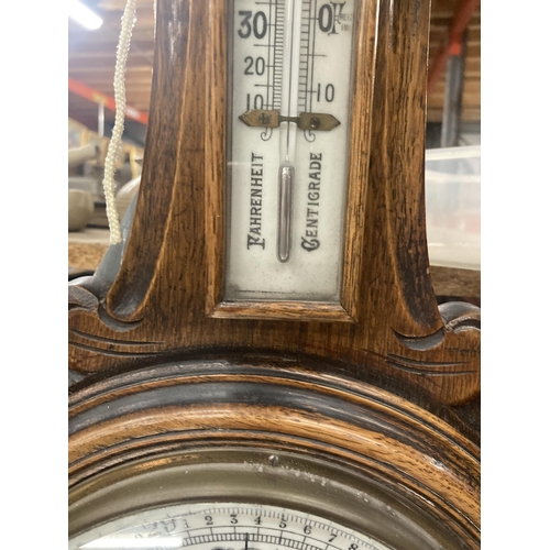 1108 - A VINTAGE CARVED MAHOGANY CASED ANEROID BAROMETER