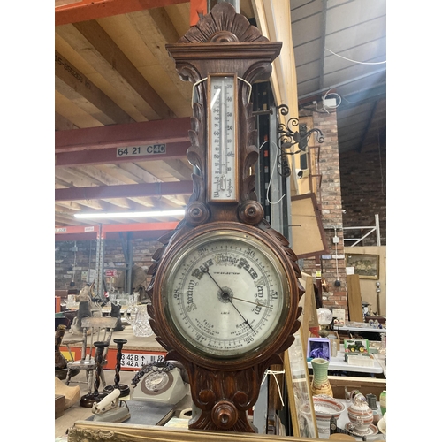 1119 - A W W GOLDSTRAW ANEROID BAROMETER IN A CARVED MAHOGANY CASE