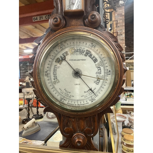 1119 - A W W GOLDSTRAW ANEROID BAROMETER IN A CARVED MAHOGANY CASE