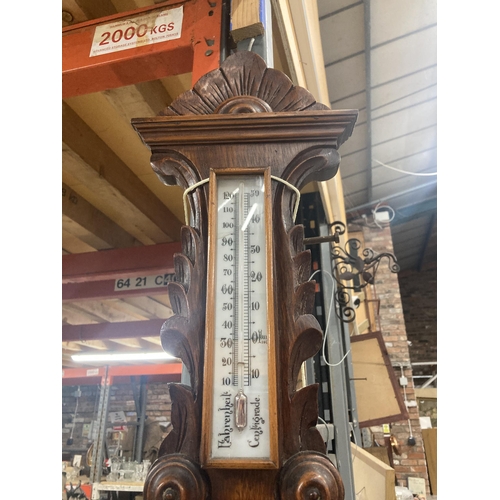 1119 - A W W GOLDSTRAW ANEROID BAROMETER IN A CARVED MAHOGANY CASE