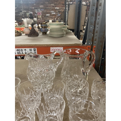 1129 - A QUANTITY OF GLASS TUMBLERS AND TWO WATER JUGS