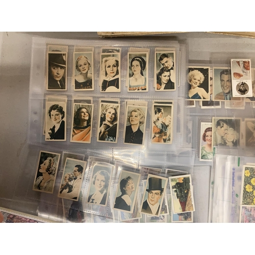 966 - A COLLECTION OF CIGARETTE CARDS IN SLEEVES TO INCLUDE FILM STARS, TRAINS FLOWERS, ETC