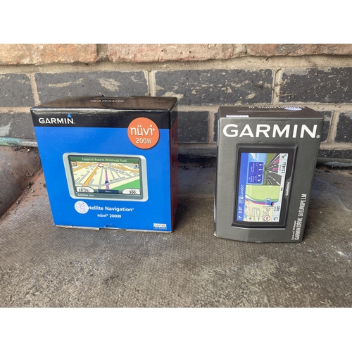 981 - TWO BOXED GARMIN SAT NAVS, A LEATHER STEERING WHEEL COVER, CAR RADIO, ETC