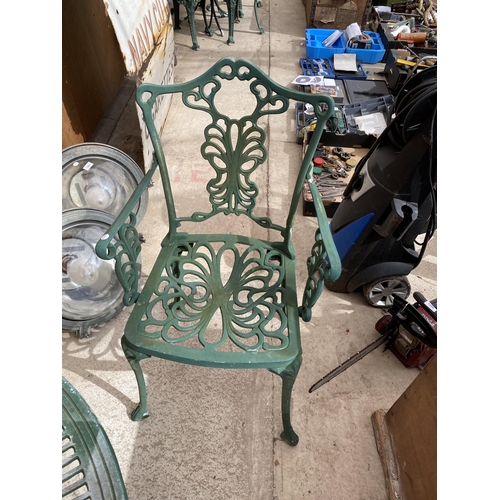 1582 - A CAST ALLOY BISTRO SET COMPRISING OF A ROUND TABLE AND TWO CARVER CHAIRS