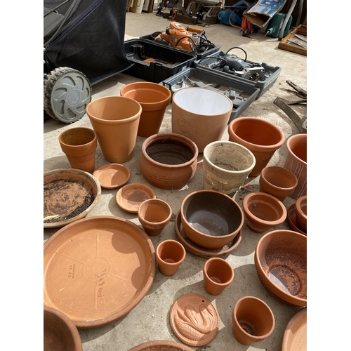 1604 - A LARGE ASSORTMENT OF TERRACOTTA PLANT POTS AND DISHES