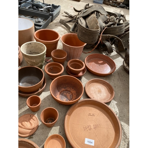 1604 - A LARGE ASSORTMENT OF TERRACOTTA PLANT POTS AND DISHES