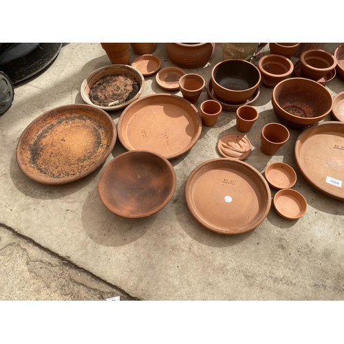 1604 - A LARGE ASSORTMENT OF TERRACOTTA PLANT POTS AND DISHES