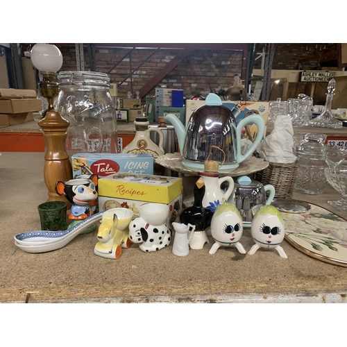 1126 - A MIXED LOT TO INCLUDE NOVELTY EGGCUPS, A STINLESS STEEL AND CERAMIC RETRO TEAPOT, ICING SETS, RECIP... 