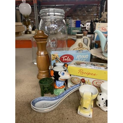 1126 - A MIXED LOT TO INCLUDE NOVELTY EGGCUPS, A STINLESS STEEL AND CERAMIC RETRO TEAPOT, ICING SETS, RECIP... 