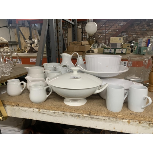 1127 - A LARGE QUANTITY OF WHITE KITCHENWARE TO INCLUDE  JUGS, CAKESTAND, TUREEN, VINEGAR BOTTLE ETC.,