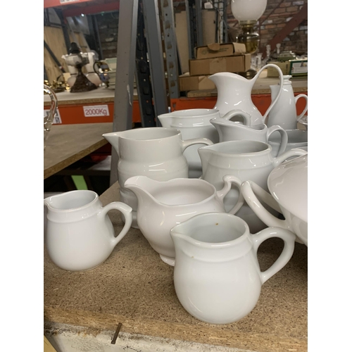 1127 - A LARGE QUANTITY OF WHITE KITCHENWARE TO INCLUDE  JUGS, CAKESTAND, TUREEN, VINEGAR BOTTLE ETC.,