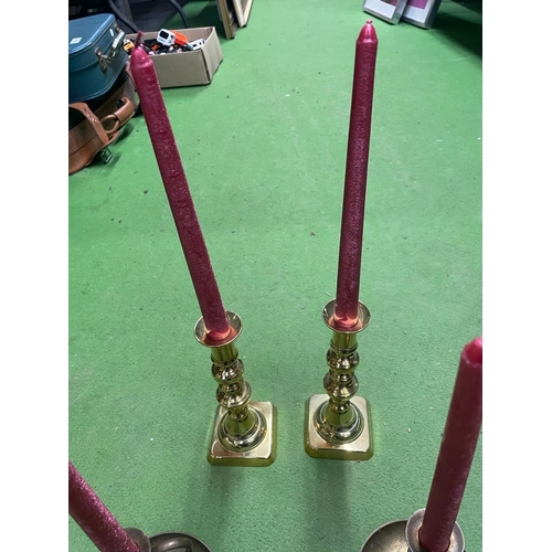 1017A - TWO PAIRS OF VINTAGE BRASS CANDLESTICKS WITH CANDLES