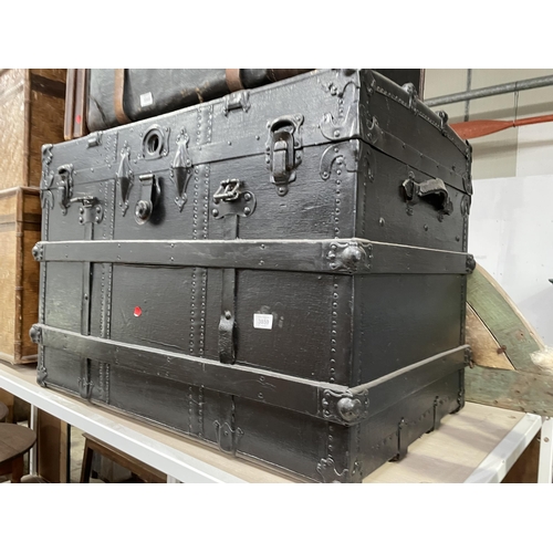 3859 - A BLACK PAINTED TRAVELLING TRUNK