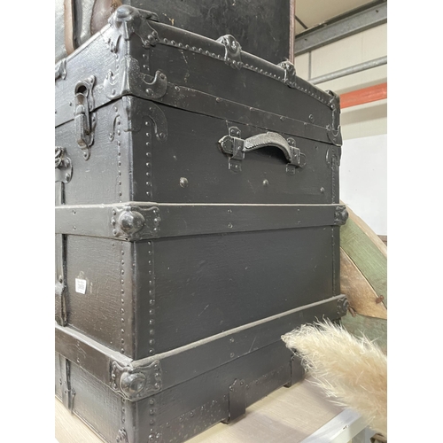 3859 - A BLACK PAINTED TRAVELLING TRUNK