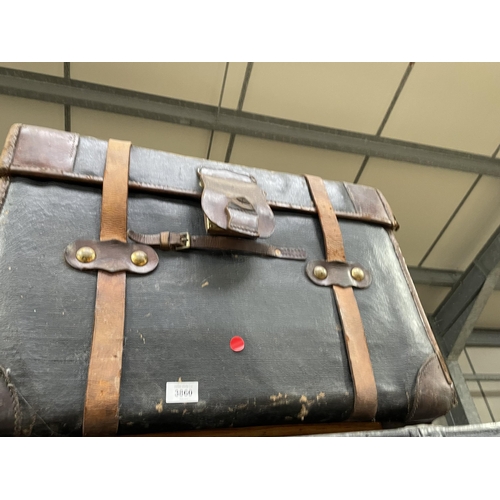 3860 - A VINTAGE CANVAS TRAVELLING TRUNK WITH LEATHER SUITCASE