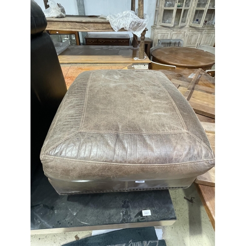 3868 - A VINTAGE LEATHER FOOTSTOOL