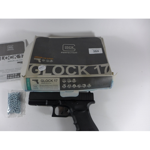 384 - A BOXED GLOCK 17 .177 CALIBRE CO2 BB GUN, 8.5CM BARREL, LENGTH 19CM, SPARE CO2, BBS ETC