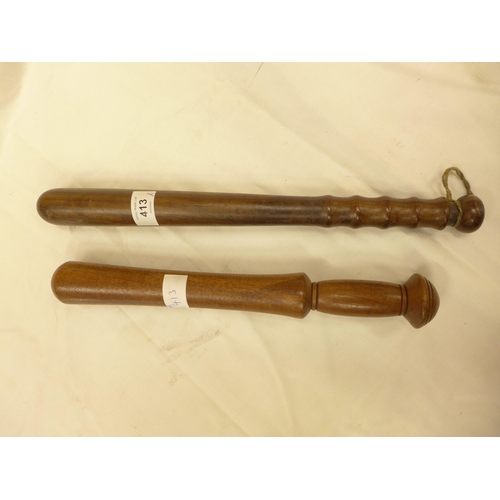 413 - TWO WOODEN POLICE TRUNCHEONS, 35CM AND 40CM LONG