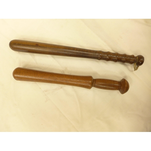 413 - TWO WOODEN POLICE TRUNCHEONS, 35CM AND 40CM LONG