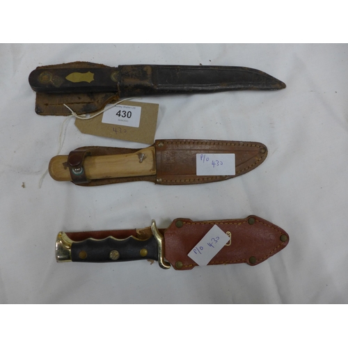 430 - THREE ASSORTED KNIVES AND SCABBARDS