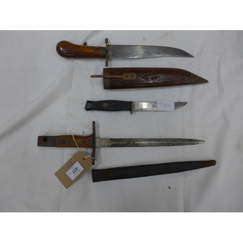 431 - A BAYONET AND SCABBARD, 23CM BLADE, TWO FURTHER KNIVES (3)